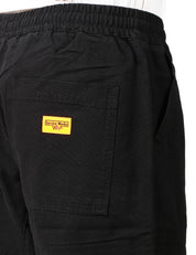 PANTALONE UOMO SERVICE WORKS NERO IN COTONE BIOLOGICO CON COULISSE E TASCHE APPLICATE DAVANTI E DIETRO
