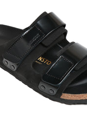 CIABATTA BIRKENSTOCK UJI NERA IN PELLE SCAMOSCIATA CON DOPPIA CHIUSURA REGOLABILE IN PELLE LUCIDA