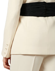 COMPLETO DONNA CARLA RUIZ NATURAL CON MAXI FIOCCO NERO SULLA GIACCA E PANTALONE DRITTO