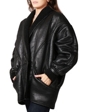 ECO-MONTONE DONNA NINEMINUTES NERO SHEARLING CON DUE BOTTONI E MANICA VOLUMINOSA