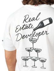 T-SHIRT UOMO MC 2 SAINT BARTH PORTLAND BIANCA IN COTONE CON STAMPA "REAL ESTATE DEVELOPER"