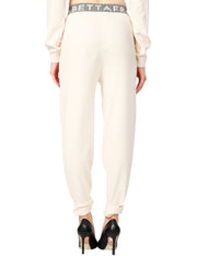 Pantalone jogger in maglia con inserti logati